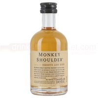 Miniature bottle of Monkey Shoulder Whisky with beige label and black cap, 5cl size.