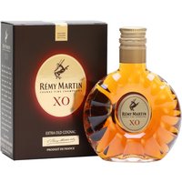 Remy Martin XO Cognac 5cl miniature with amber liquid in a round, fluted bottle and gold cap, beside a dark box.