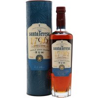 Santa Teresa 1796 Solera Rum bottle with blue label, gold accents, and matching cylindrical box.