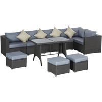 Rattan sofa set with grey frame, dusty blue cushions, includes corner sofa, two ottomans, and a rectangular table.