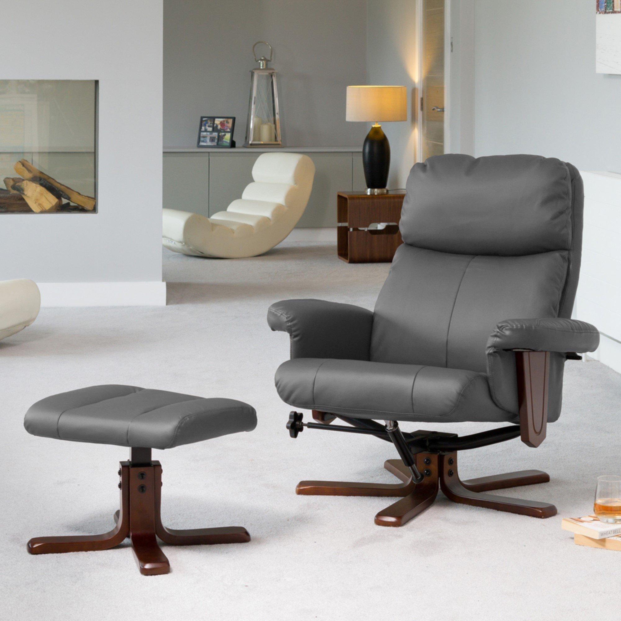 Gray leather swivel recliner with matching ottoman, featuring a wooden base, massage and heat functions, set in a modern living room with neutral decor.