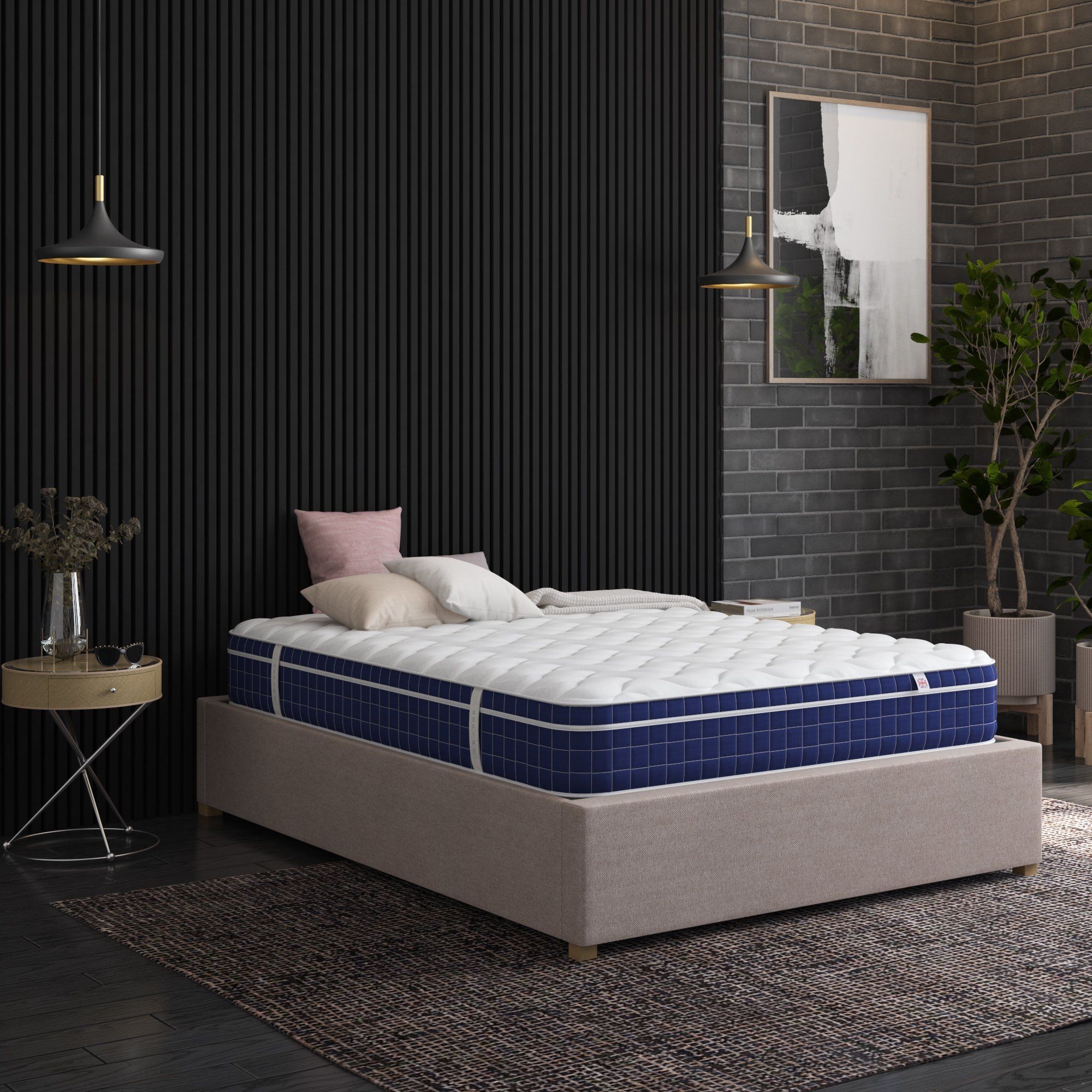Aspire Invigorate Pocket Memory Foam Hybrid Mattress in white, featuring a quilted top and blue checkered sides, placed on a beige bed frame in a modern room with dark decor.