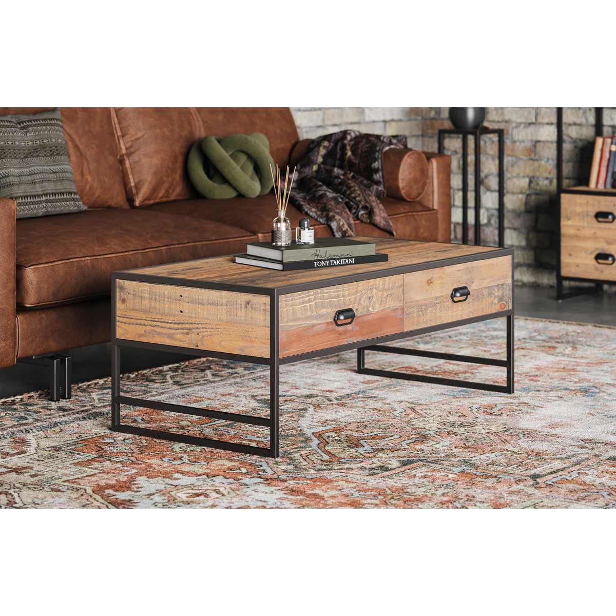 Rustic brown coffee table from the Molly and Milo London Rustic Revival Collection, featuring four drawers, a sturdy metal frame, and a textured wood top, set in a cozy living room.