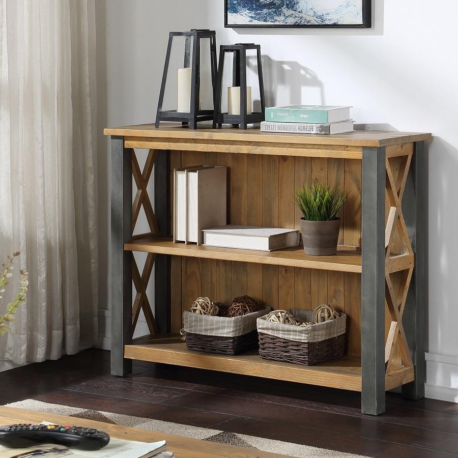 Reclaimed brown wood low bookcase with two shelves, metal frame, and cross-back design, styled with decorative lanterns, candles, and woven baskets.