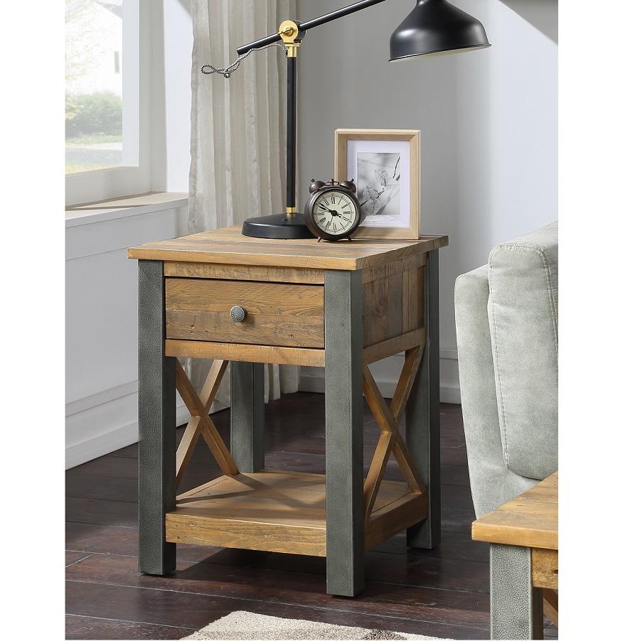 Reclaimed brown wood lamp table featuring a single drawer, metal accents, an open shelf, and an X-shaped design, complemented by a black desk lamp and decorative items.