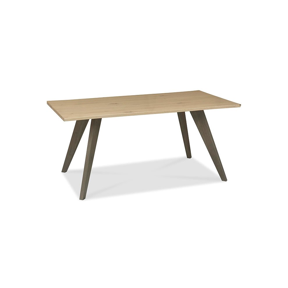 Light oak dining table with a smooth surface, featuring tapered gray legs, designed for six people, showcasing a modern and minimalist aesthetic.