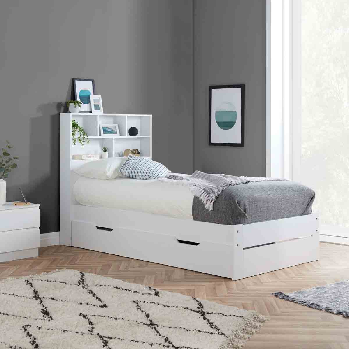 Single white storage bed frame with a 3FT design, featuring a headboard with shelves, two drawers underneath, and a cozy bedding setup against a modern interior backdrop.
