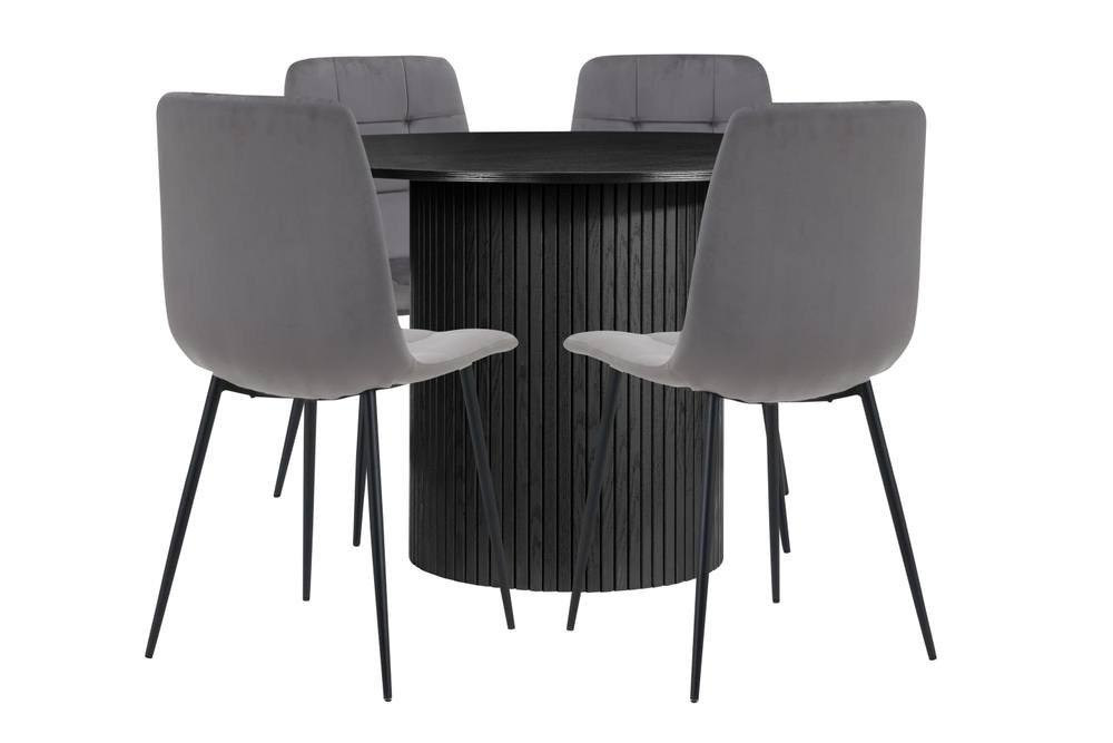 Round black fluted dining table paired with four grey velvet chairs, featuring sleek black metal legs for a modern aesthetic.