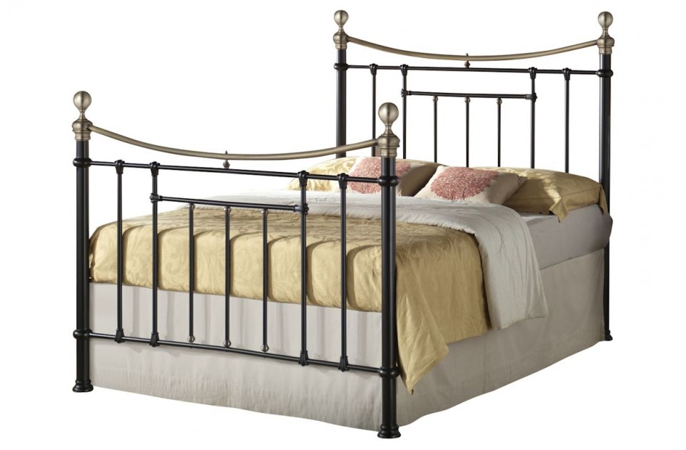 Birlea Bronte King Bed features a black metal frame with elegant curved head and footboards, complemented by brass accents and a plush beige and gold bedding set.