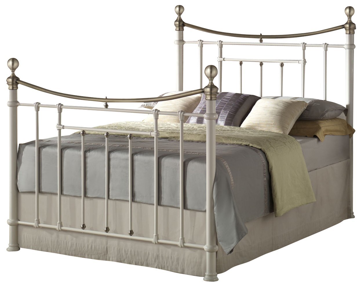 Cream metal king bed with decorative curved headboard and footboard, featuring silver accents and a plush bedding arrangement in neutral tones.