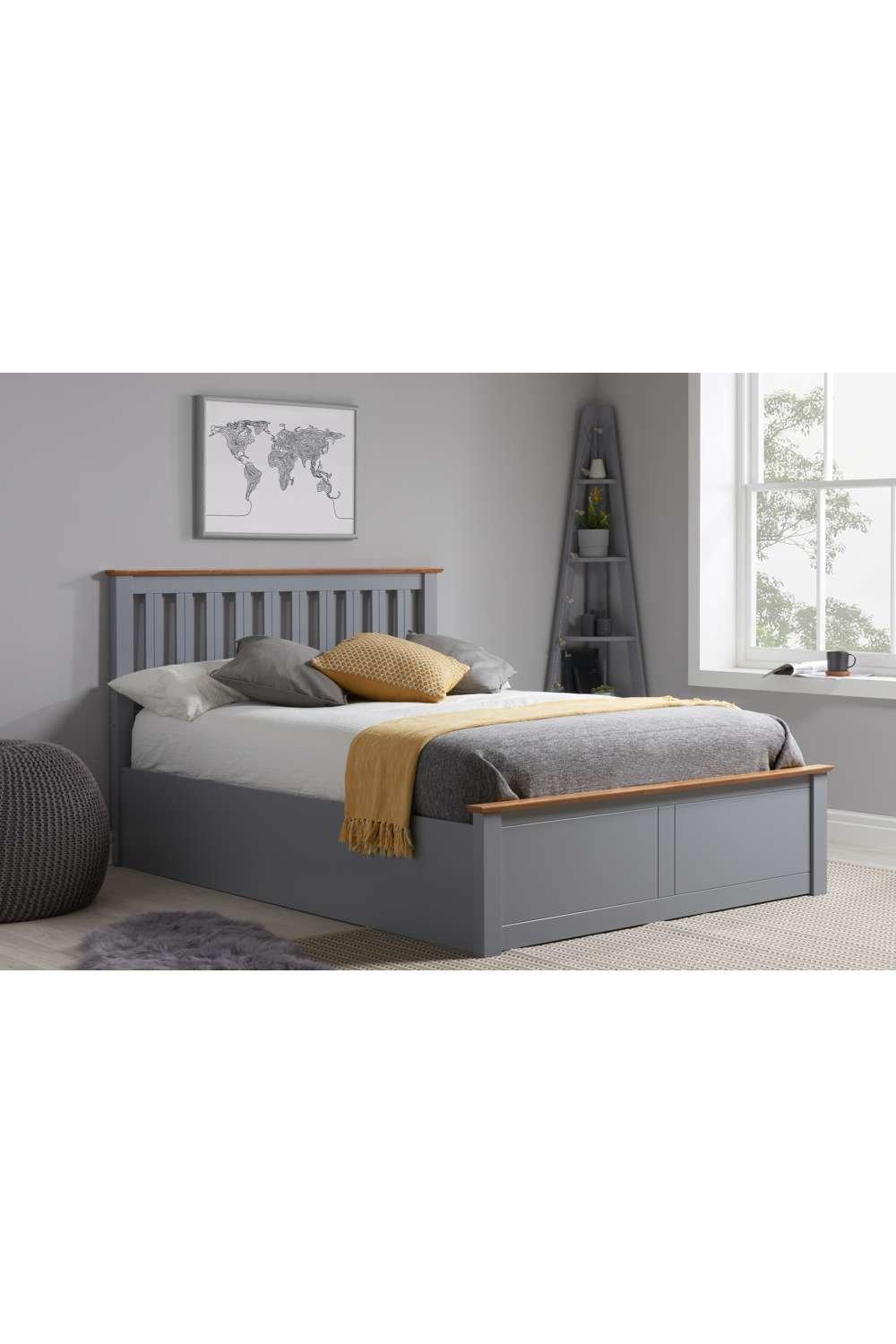Solid wood double ottoman storage bed frame in dark grey with a gas lift mechanism, featuring a slatted headboard and a light wood accent on the top edge.