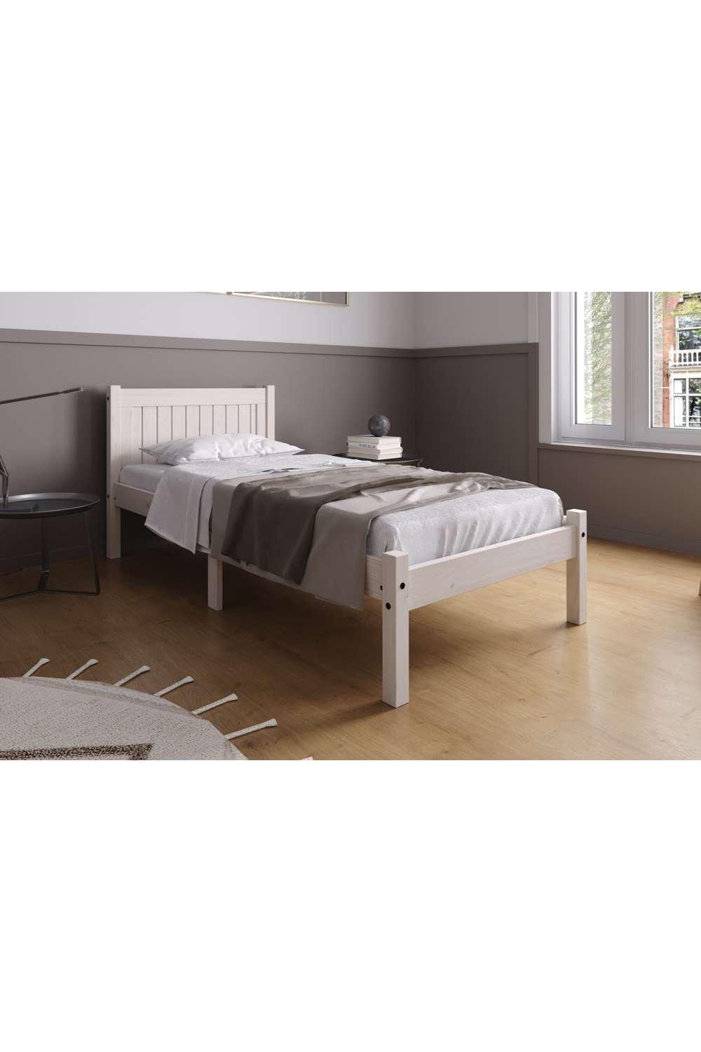 Single Trent Bed by Birlea in white, featuring a slatted headboard, sturdy wooden frame, and a simple design, set in a modern room with wooden flooring and neutral decor.