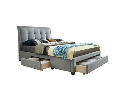 Grey upholstered king bed with a tufted headboard, featuring two spacious drawers underneath for storage, complemented by a cozy bedding arrangement.