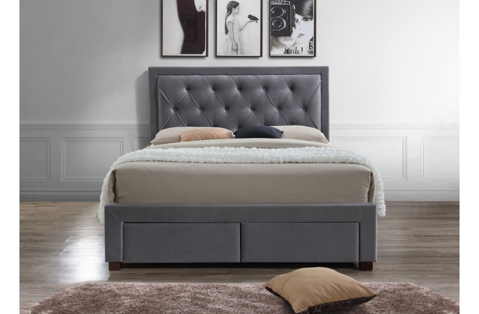 Grey velvet super king bed with a tufted headboard, featuring two storage drawers at the base, set against a minimalist wall with framed art.