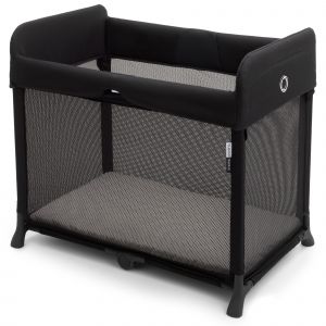 Black Bugaboo Stardust Travel Cot features a mesh side panel for visibility, a soft padded top, and a sturdy frame, designed for easy setup and portability.
