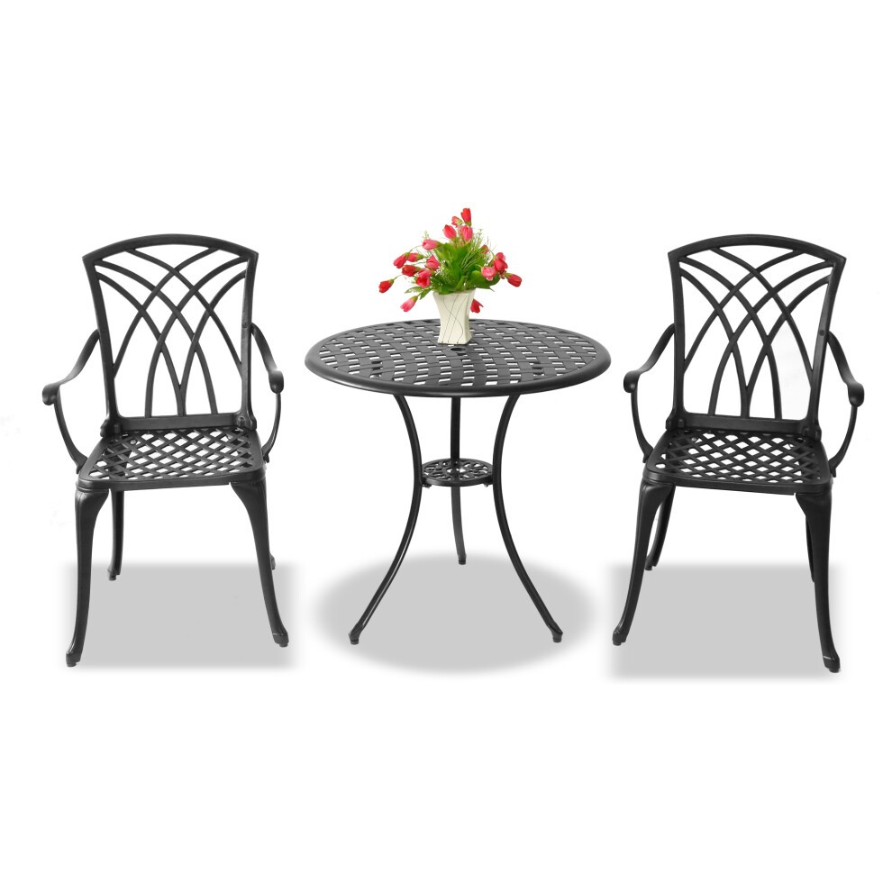 Luxurious black cast aluminium bistro set featuring a round table and two intricately designed chairs, complemented by a vase of red tulips.