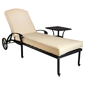 Black cast aluminium sun lounger recliner with a beige cushion, featuring a sleek design and a small side table for convenience.