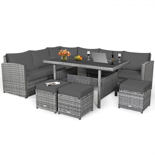 Gray rattan sectional sofa set with plush cushions, includes a rectangular dining table and two wicker ottomans, ideal for outdoor patio use.