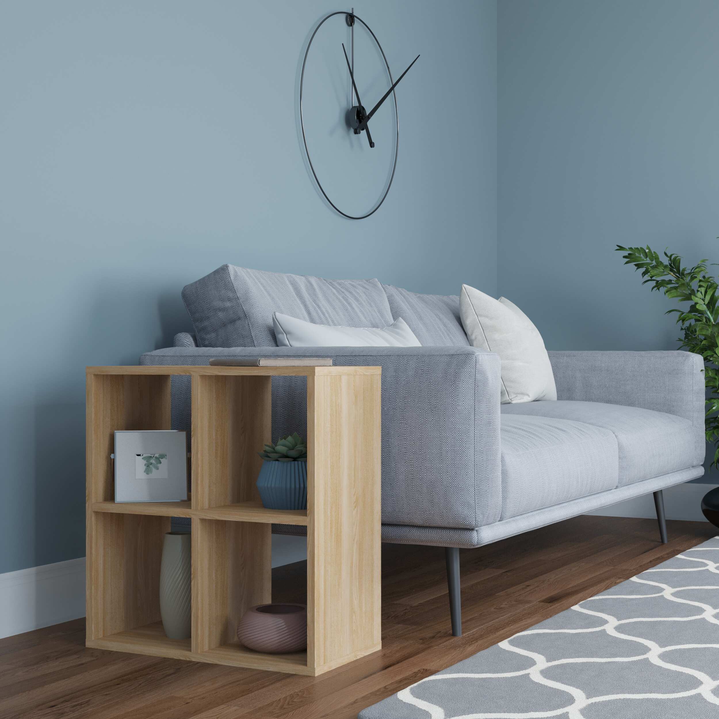 Oak side table with a yellow accent, featuring four open compartments, placed beside a light gray sofa in a modern living room setting.
