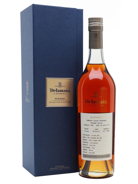 Delamain Pleiade Collection Plenitude 1980 Cognac in a tall, elegant glass bottle with a cork stopper, featuring a rich amber color and a blue box with gold lettering.
