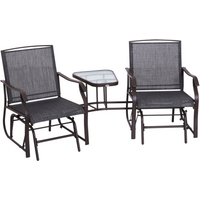 Brown metal double glider rocking chairs with high backs and a central glass-top garden table.