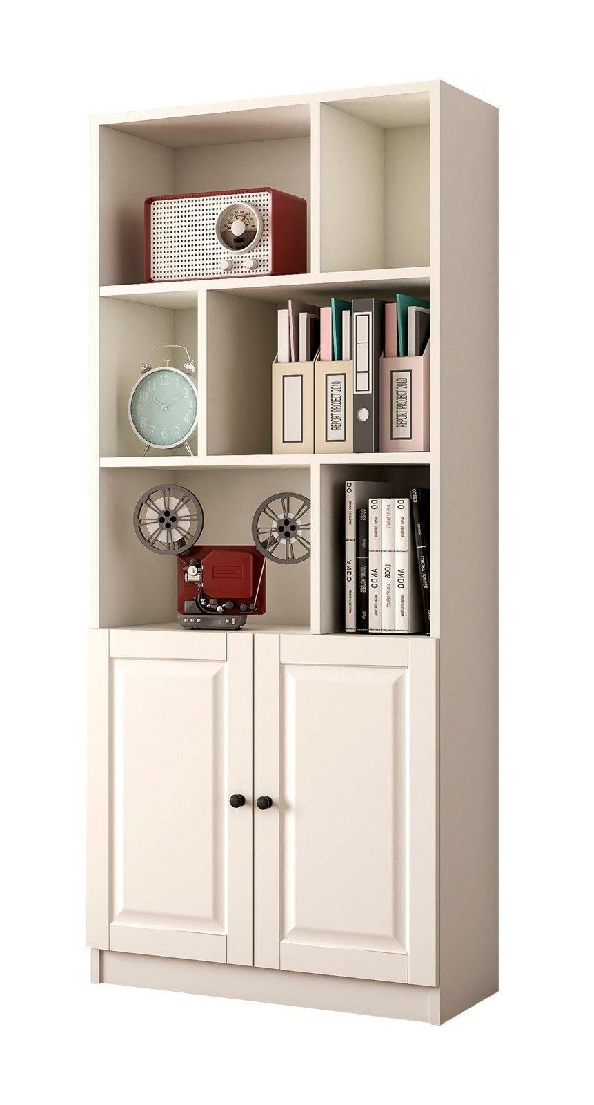 Tall white bookcase with two doors, featuring open shelves displaying a clock, books, and decorative items, complemented by a classic design and smooth finish.