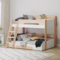 Triple bunk bed in oak and white, featuring a sturdy wooden frame, two lower beds with storage drawers, and a ladder, adorned with patterned cushions and pillows.