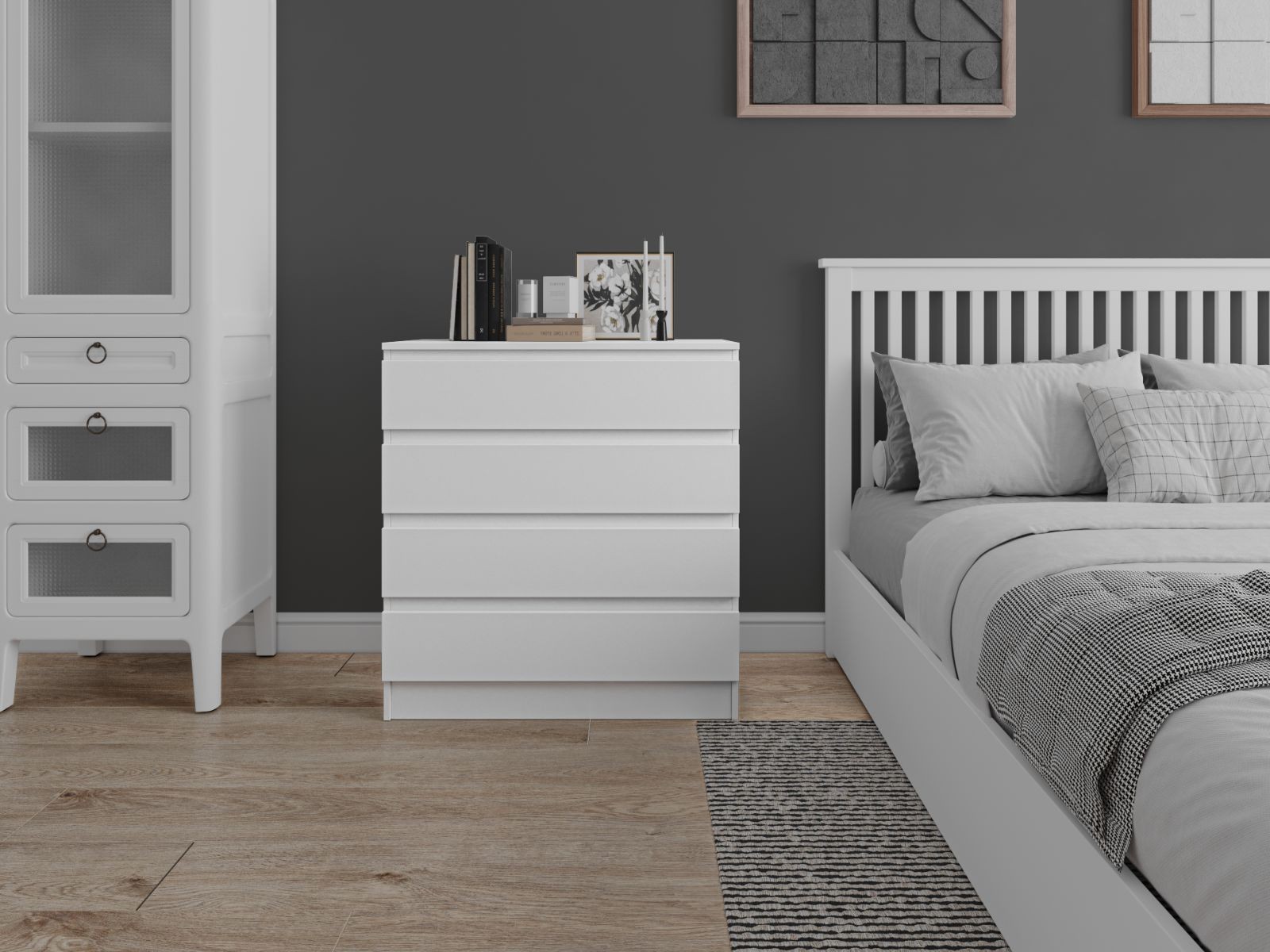 White chest of four drawers with a sleek design, featuring smooth surfaces and minimalist handles, set against a dark gray wall in a modern bedroom.