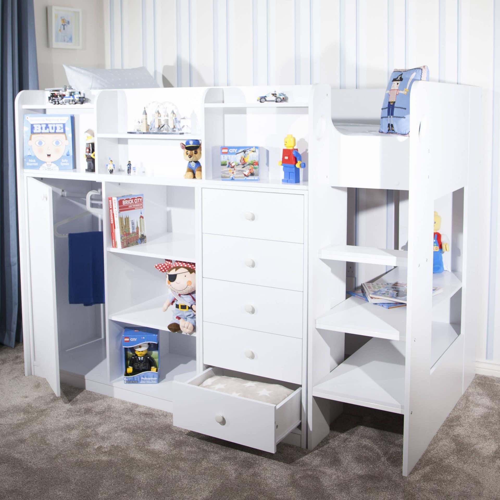 White wooden mid-high sleeper storage station featuring shelves, drawers, and a ladder, designed for toys and books, with a cozy carpeted floor.