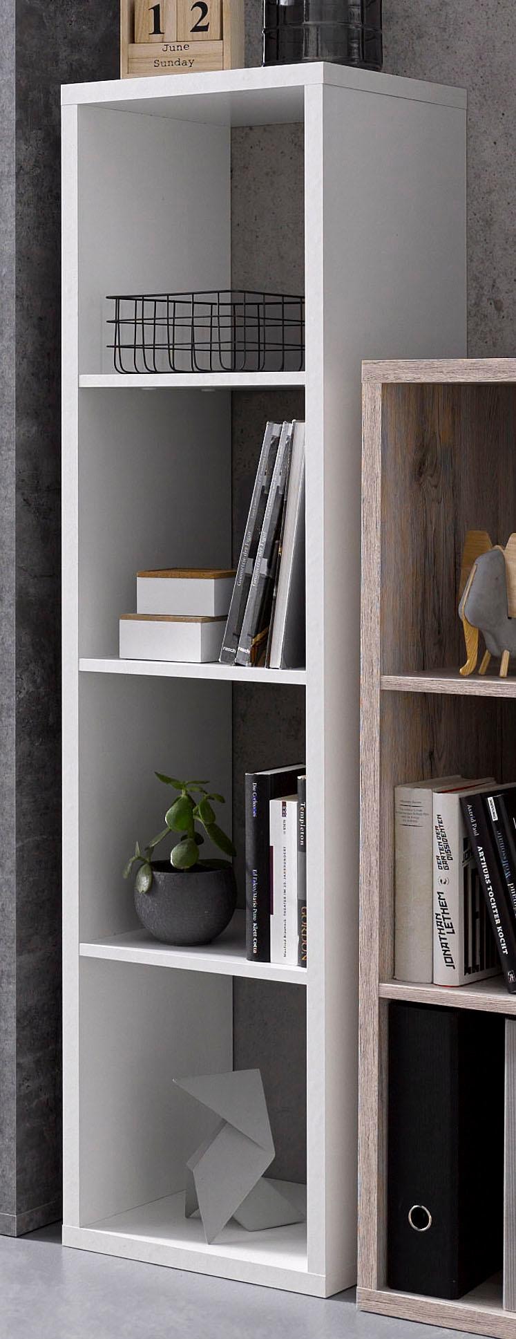 Mauro 3-shelf storage unit in matte white finish, featuring open shelves, a potted plant, books, and decorative items, set against a textured gray background.