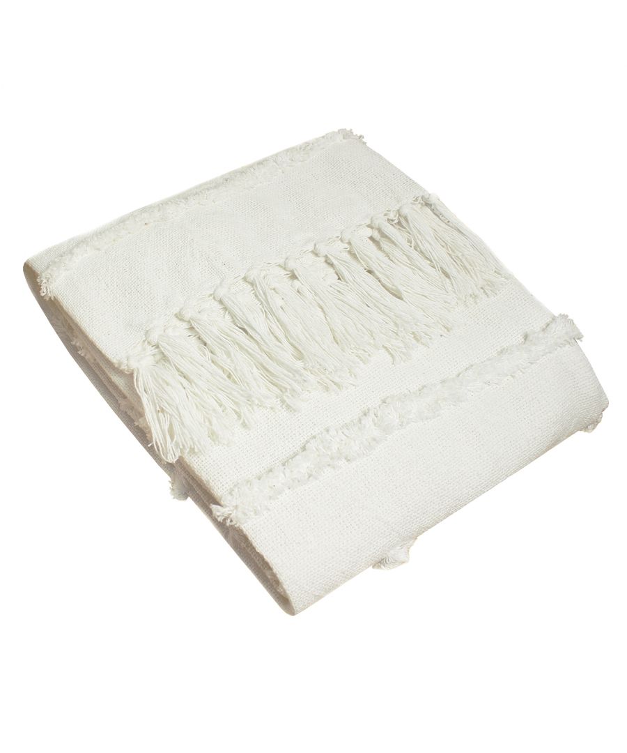 Natural cotton throw in a soft cream color, featuring textured fringes along the edges and a simple, elegant design, perfect for adding warmth to any space.