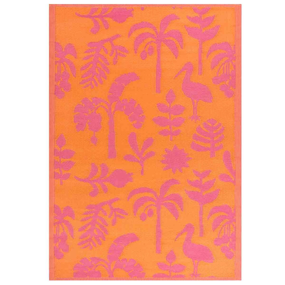 Bright orange rug featuring a tropical pattern with pink silhouettes of palm trees, birds, and flowers, suitable for both indoor and outdoor use.