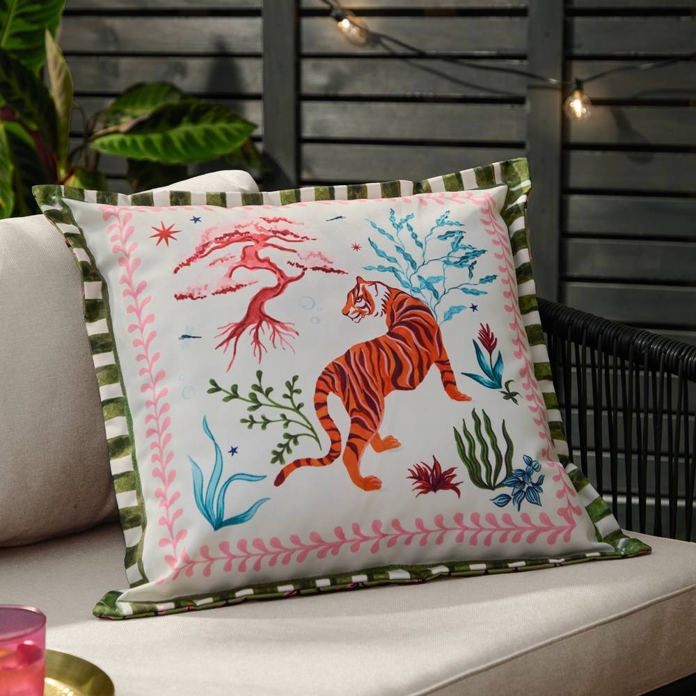 Square outdoor cushion featuring a vibrant, illustrated tiger in orange and black, surrounded by colorful plants and coral, with a striped green and white border.