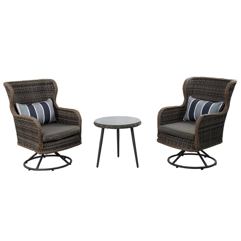 Brown rattan 10-piece modular outdoor sofa set featuring plush gray cushions, striped accent pillows, and a round side table with a stone-like top.