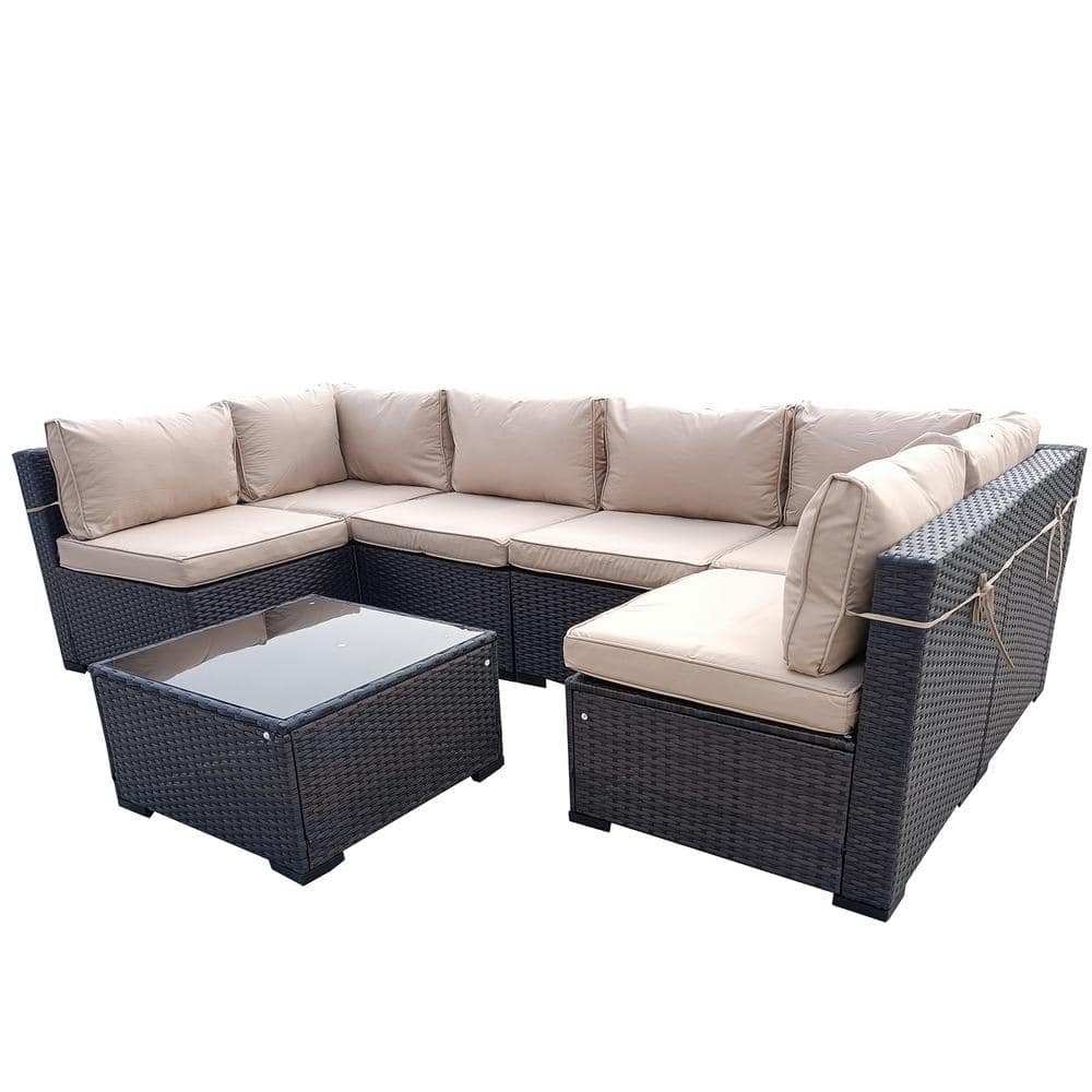Grey rattan 10-piece modular outdoor sofa set featuring plush beige cushions and a matching glass-topped coffee table, designed for comfort and style.