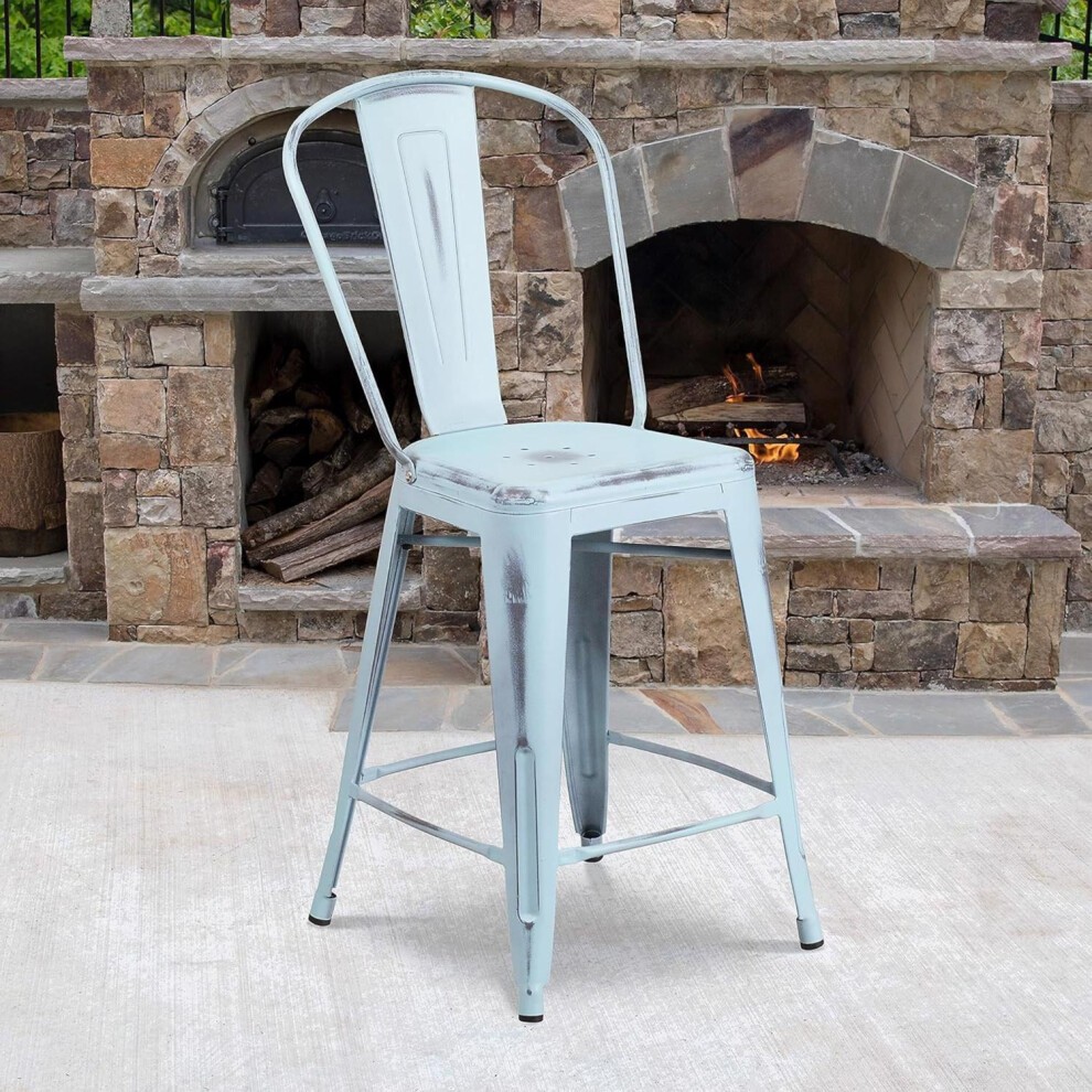 Set of 4 baby blue distressed bar stools made of galvanized steel, featuring a classic design with a high back and sturdy legs, set against a stone fireplace backdrop.