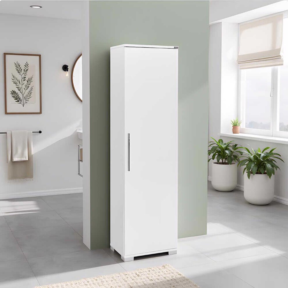 Sleek white gloss storage cabinet with a single door and metal handle, featuring a modern design, set against a light green wall in a bright room with plants.