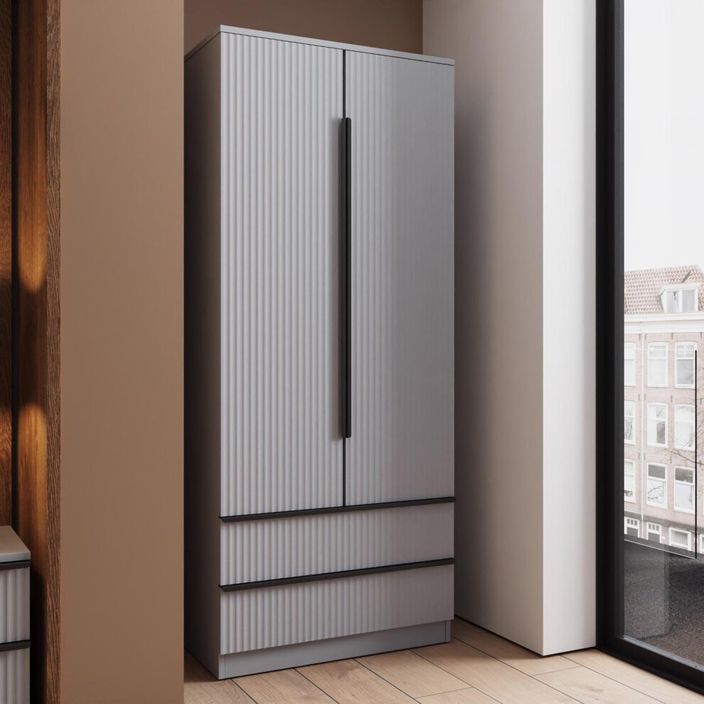 Dark grey wardrobe with a ripple effect, featuring two doors and two drawers, sleek metal handle, and a modern design, positioned near a window.