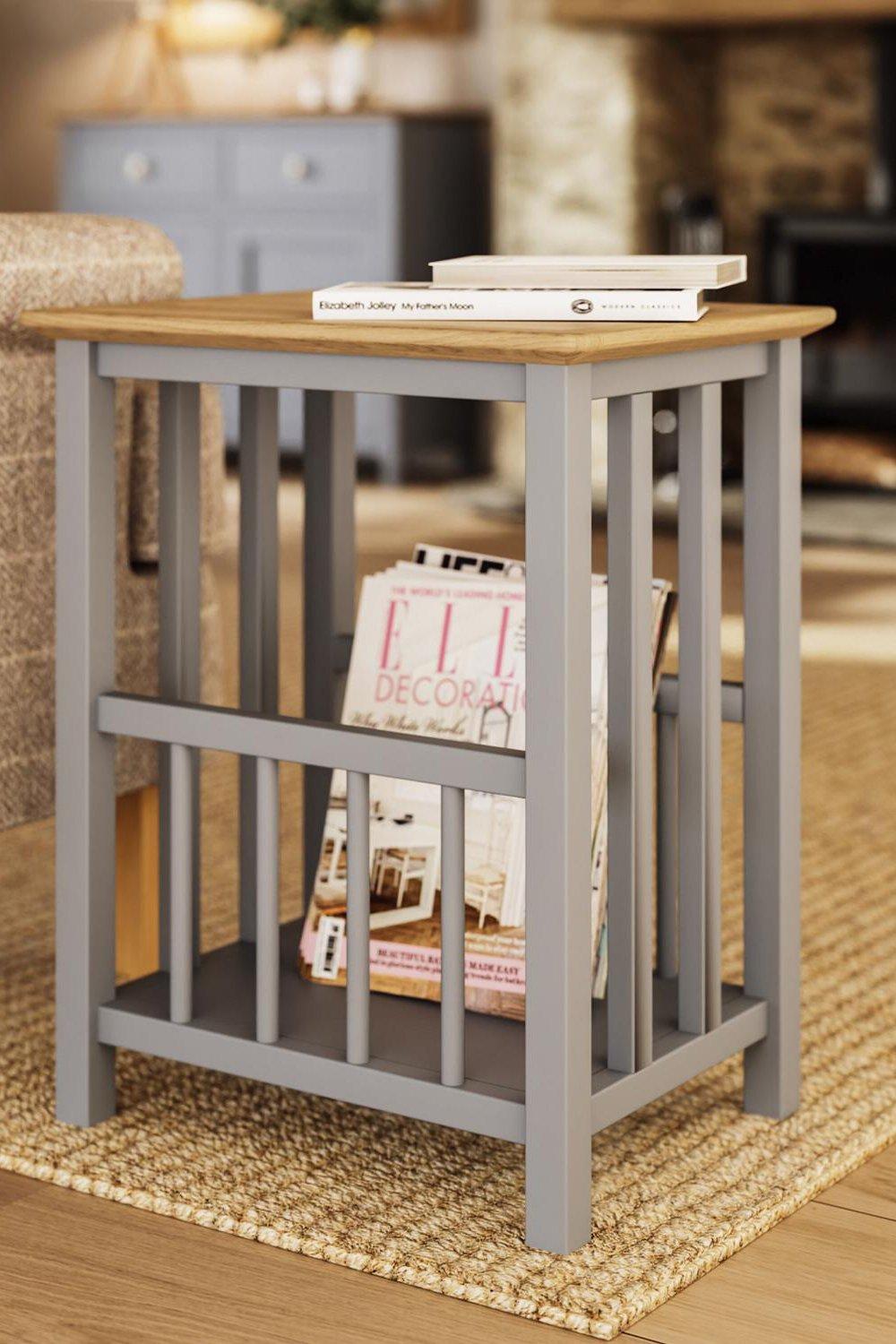 Solid oak magazine rack table in grey with a natural wood top, featuring vertical slats and an open shelf for storage, ready assembled for immediate use.