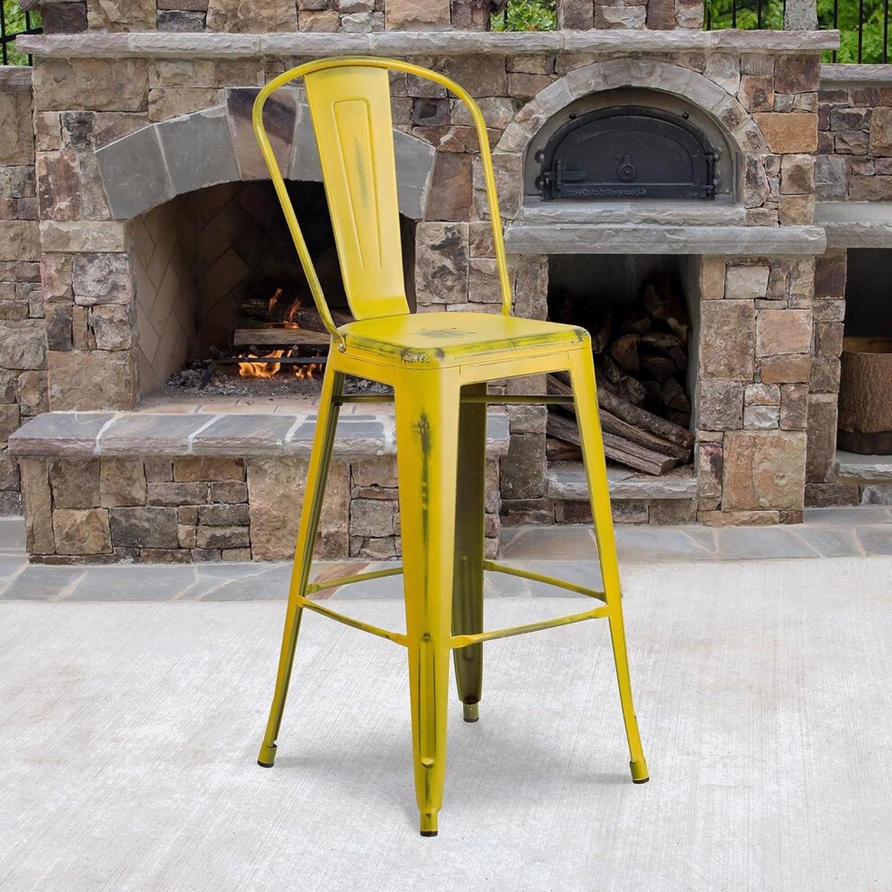 Set of four 30-inch yellow distressed metal bar stools, featuring a classic design with a high back and sturdy legs, suitable for indoor or outdoor use.