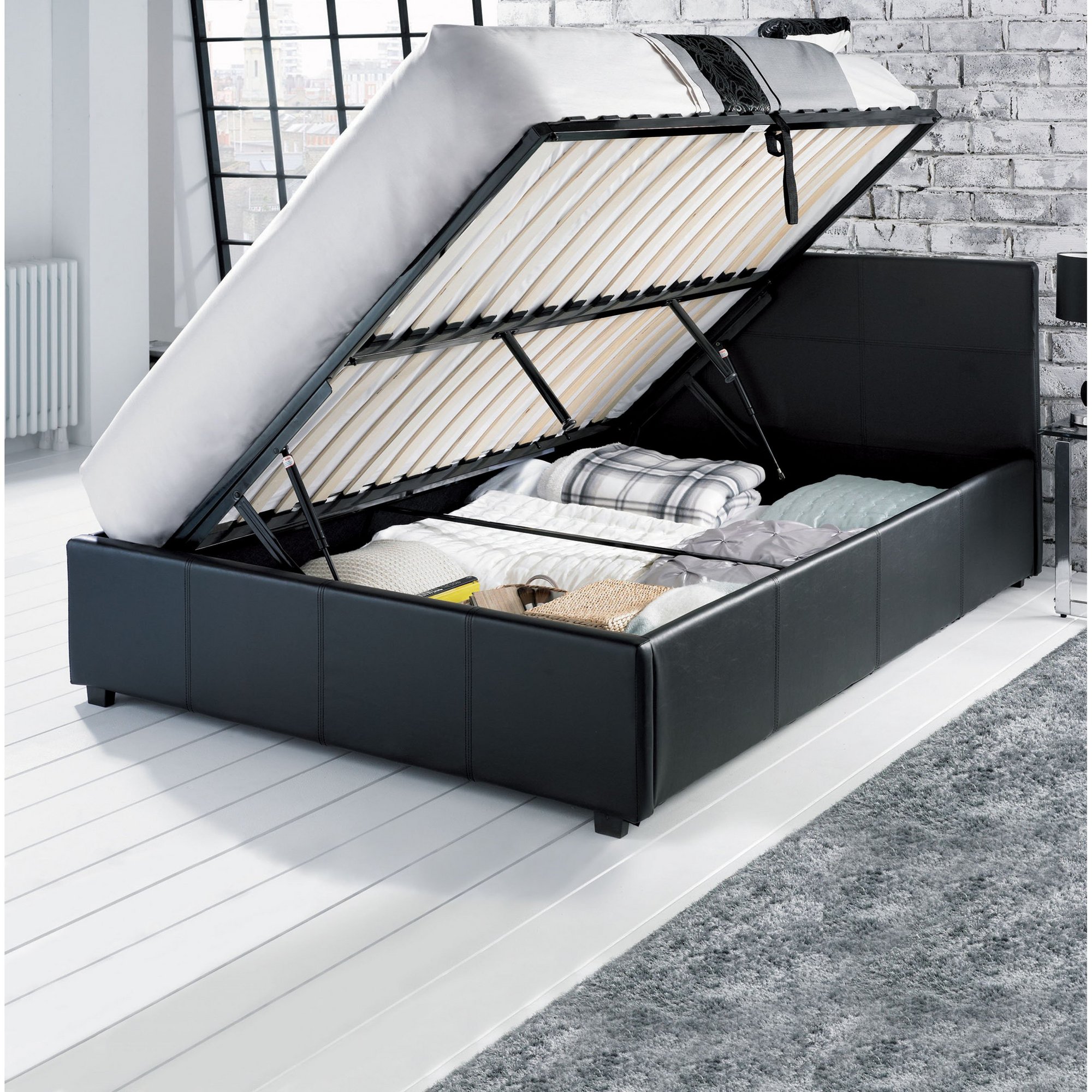 Black faux leather ottoman storage bed with a 150cm mattress, featuring a lift-up mechanism revealing spacious storage for bedding and blankets.