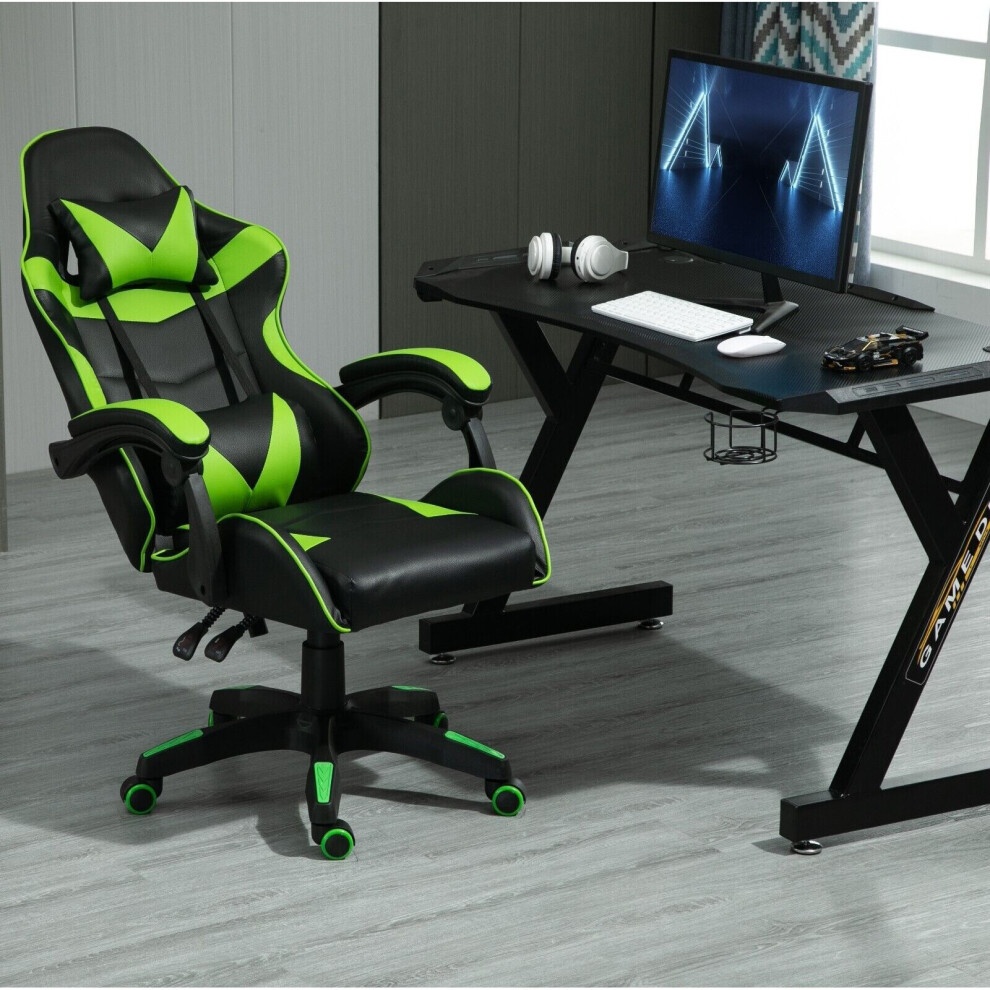 Green and black gaming chair with a sleek design, featuring a tilt and swivel function, positioned beside a modern desk with a computer, headphones, and a toy car.