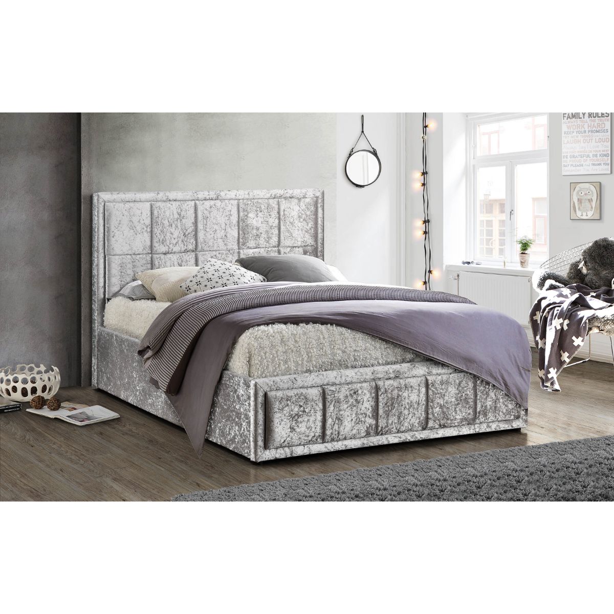 Metallic silver fabric ottoman bed frame with gas lift storage, featuring a padded headboard and a stylish, contemporary design, sized for a king mattress.