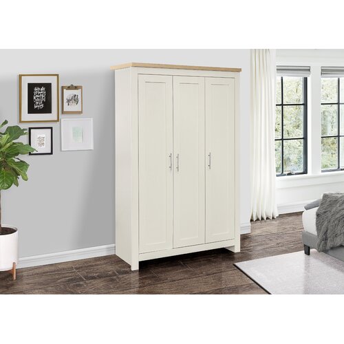 Cream and oak three-door wardrobe featuring a smooth finish, sleek silver handles, and a minimalist design, set against a neutral wall and natural light.