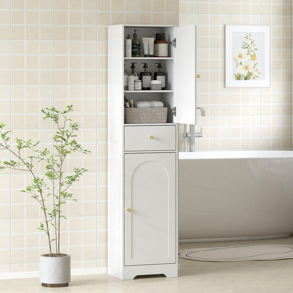 Tall white bathroom storage cabinet with arch doors, featuring an adjustable shelf, gold handles, and a sleek design, set against a light tiled wall and a bathtub.