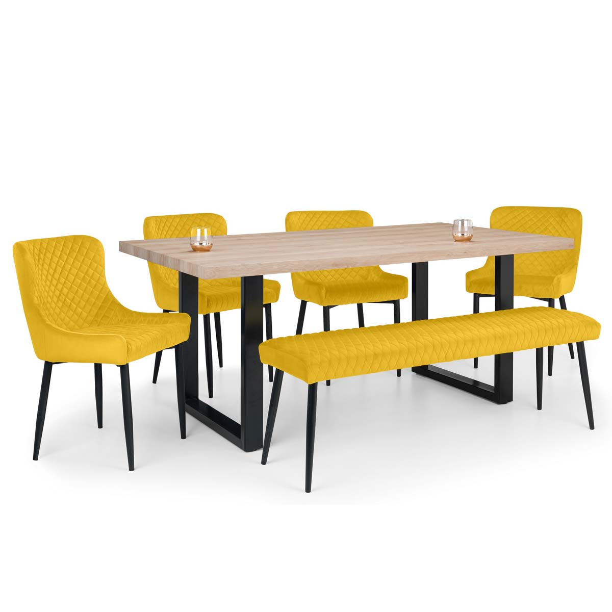 Set includes a brown dining table with a light wood top and black metal legs, accompanied by four mustard yellow upholstered chairs and a matching low bench.
