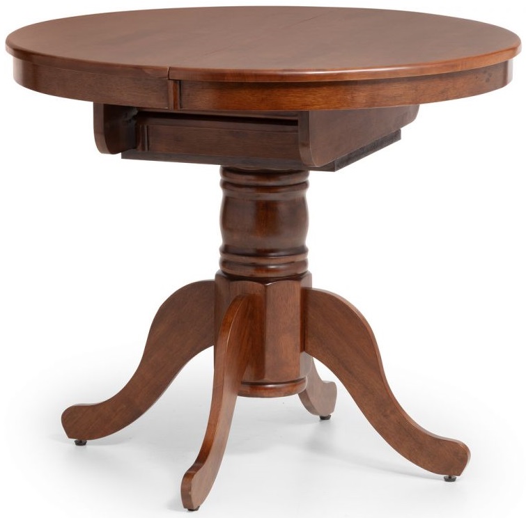 Round to oval extending table in mahogany finish, featuring a sturdy pedestal base with four curved legs and a smooth surface for dining or gatherings.