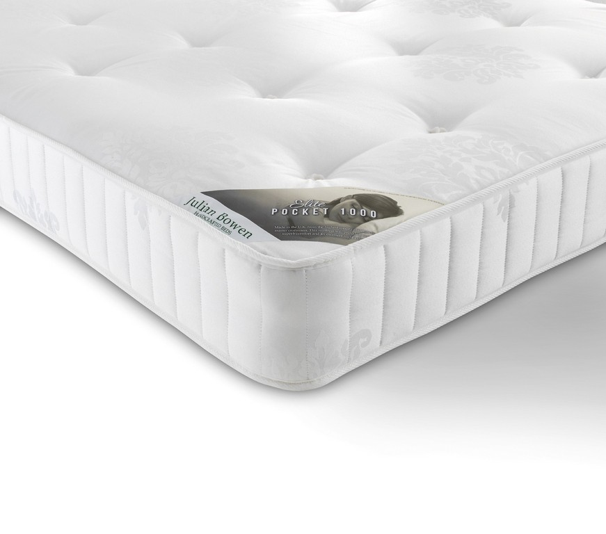 White pocket spring mattress with a plush top, featuring a subtle floral pattern and vertical stitching, labeled "Julian Bowen Elite Pocket 1000," sized 150cm x 200cm.