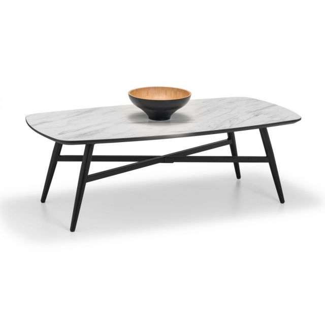 White and black marble effect coffee table with a smooth, rectangular top and black wooden legs, featuring a decorative bowl on top.