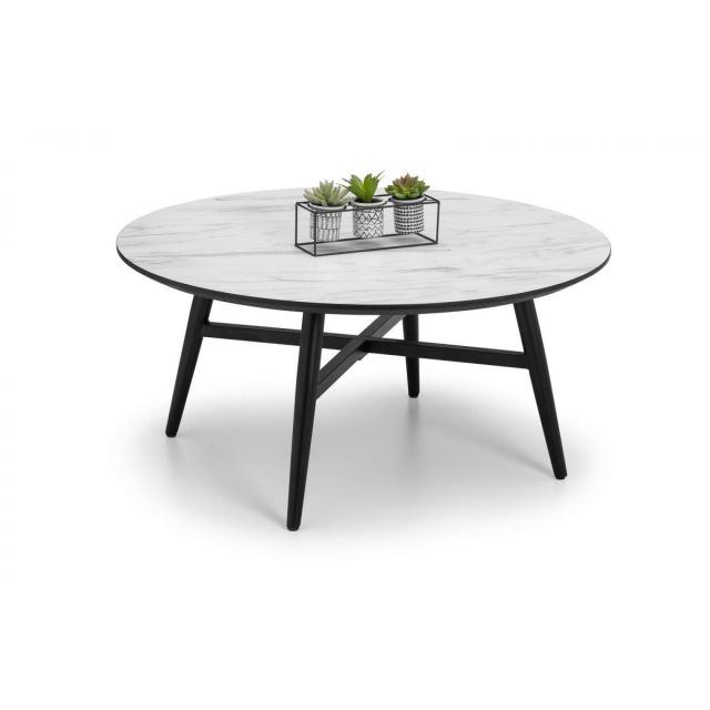 Round coffee table with a white marble effect top and black wooden legs, featuring a small wire planter with succulents on the surface.